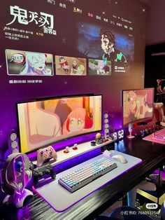 two computer monitors sitting next to each other on top of a wooden desk in front of a purple wall