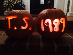 two carved pumpkins with the word pi on them