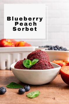 blueberry peach sorbet in a white bowl on a wooden table with fresh fruit