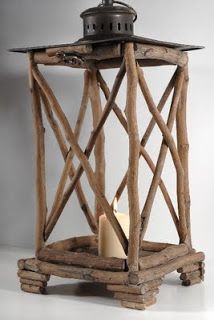 a wooden lantern with a candle in it