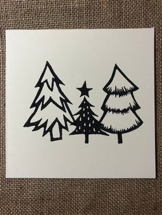 a card with trees drawn on it and stars in the sky next to each other