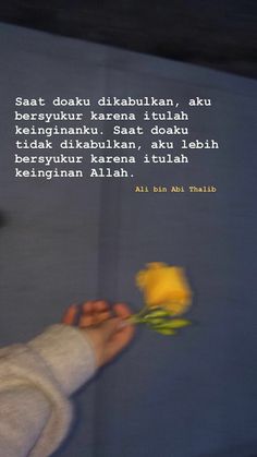 a woman holding a yellow rose in her right hand with a poem written on it