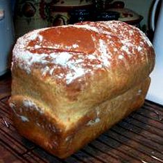 a loaf of bread sitting on top of a cooling rack