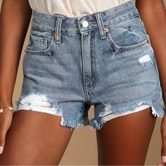 Sturdy Denim Shapes These Must-Have Shorts That Have A High-Waisted Fit With Belt Loops And A Classic Five-Pocket Cut. Heavy Distressing Accents The Shorts Before Ending At A Frayed, Cutoff Hems. Top Button Closure And Hidden Zipper Fly. Unlined. 100% Cotton. Distressed High Rise Washed Blue Shorts, Washed Blue High Rise Distressed Shorts, High Rise Distressed Washed Blue Shorts, Distressed Washed Blue Short Length Bottoms, Washed Blue Distressed Short Bottoms, High Waist Ripped Washed Blue Bottoms, Ripped Washed Blue Short Jeans, Ripped Washed Blue Short Length Jeans, Washed Blue Ripped Short Length Jeans