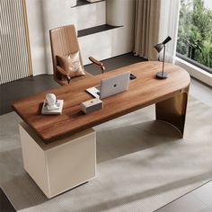 a wooden desk with a laptop on it in front of a window and a chair