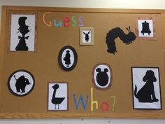 a bulletin board with various silhouettes on it