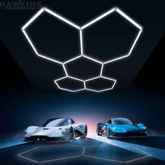 two electric sports cars in front of a black background with the words hawkins on it