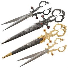 four different types of scissors with ornate designs on them, all in gold and silver