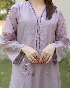 This lilac dress is an eye catching 3 piece suit , perfect for summer evening events. It is crafted from khaadi net featuring unique style embroidery on shirt or lace detailing and thread work on sleeves. Paired with cotton silk pants and two toned crepe silk dupatta with lace detailing all over. Embroidery On Shirt, Work On Sleeves, Lace Suit, Lace Dress Design, Simple Kurta Designs, Simple Kurti Designs, Trendy Shirt Designs, Kurti Designs Latest, Kurti Embroidery Design