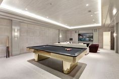 a pool table in the middle of a living room