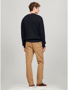 Tommy Hilfiger men's sweater. Made from soft cotton in a textured cable knit weave, this crewneck sweater is the perfect layer, complete with rib-knit cuffs, collar and hem with touches of subtle branding throughout.  Material: 100% Cotton. Tommy Hilfiger Sweater With Ribbed Cuffs For Fall, Tommy Hilfiger Fall Sweater With Ribbed Cuffs, Knit Crewneck, Tommy Hilfiger Man, Knit Cuff, Crewneck Sweater, Men's Sweater, Crew Neck Sweater, Cable Knit