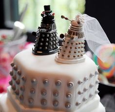 a cake decorated to look like the doctor whos talking to each other on top of it