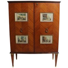 a wooden cabinet with two pictures on it