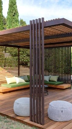 a large wooden gazebo sitting on top of a wooden deck