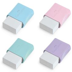 four different colored erasers sitting next to each other