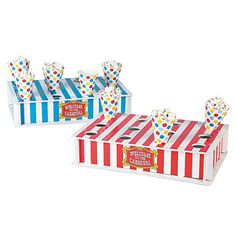 two striped boxes with popcorn in them on a white background, one is red and the other is blue