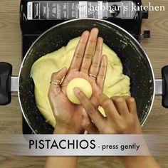 two hands are kneading dough in a pan on the stove top, with text overlay that reads pistachios - press gently