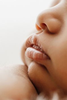 a close up of a baby's face and nose