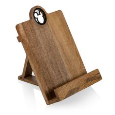 a wooden phone holder with an apple on the front and bottom, attached to a white background