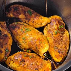 some chicken is cooking in a pan on the stove top and it looks like they have been cooked