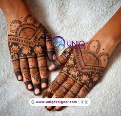 two hands with henna designs on them