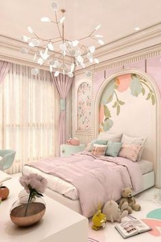 a bedroom decorated in pastel colors with pink and blue accents