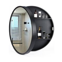 a round mirror with shelves and bottles on it