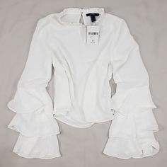 Layered Bell Sleeves. Keyhole Opening On Back. 100% Polyester. Size S Trendy Forever 21 Ruffled Tops, Forever 21 Spring Ruffle Blouse, Spring Ruffle Blouse By Forever 21, Spring Ruffled Blouse By Forever 21, Forever 21 Ruffled Tops For Spring, Chic Forever 21 Top With Ruffles, Chic Forever 21 Tops With Ruffles, Forever 21 Ruffled Top For Brunch, Chic Fitted Blouse From Forever 21