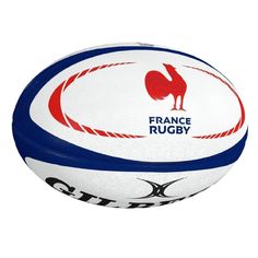 a white and blue rugby ball with an image of a rooster on the outside of it