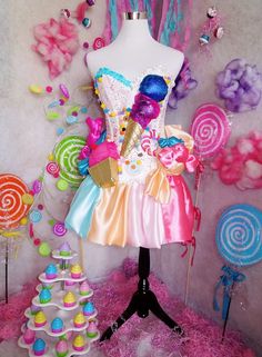 a dress made to look like an ice cream shop with lollipops and candy