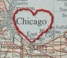 a map with a heart on it and the word chicago in red overlaided