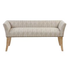 an upholstered bench with wooden legs and nail polishing on the armrests