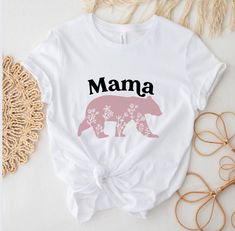 "Mama Bear Shirt Mama Graphic T Shirt Mama bear sweatshirts Mother's Day gift Plus Size Shirts Fall in love with this soft and cozy Mama bear Graphic Tee, Sweatshirt or hoodie PLEASE READ ENTIRE DESCRIPTION BEFORE PURCHASING TO MAKE YOUR SHOPPING EXPERIENCE EASIER, YOU CAN \"CHOOSE\" A T SHIRT, SWEATSHIRT OR HOODIE IN THIS LISTING. Available in Shirt, Sweatshirt and Hoodie Tee Shirt Shirt Sleeve Unisex fit Crewneck 100% Cotton Sweatshirt and Hoodies Long Sleeve Unisex fit Soft 50/50 blend S-5X S Bear Graphic Tee, Mama Bear Sweatshirt, Lulu Lemon Shorts, Bar Shirt, Mama Bear Shirt, Moon Shirt, Bear Graphic, Bear Shirt, Girls Prints