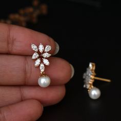 A bunch of beautiful natural white hand picked marquise and tear drop diamonds, arranged neatly to form a triangle, with a beautiful light pink pearl dangling from the center render the design in a way that your heart will surely skip a beat.. Ours did.. :) * Diamond Wt. : 1.05 Cts (Marquise + Pear) approx * Color-Clarity Grade : Near Colorless, Vs-Si Purity * Gold - 14k, 3.28 gms rose gold An exclusive piece from our shop, these earrings are absolutely to die for..! Special Earrings for your sp White Diamond Marquise Earrings, White Diamond Cluster Earrings Marquise Shaped, Pear-shaped White Diamond Earrings, White Marquise Cut Diamond Earrings With Accents, White Marquise Cluster Earrings, White Marquise Cut Diamond Earrings Fine Jewelry, Pear-shaped Diamond Bridal Earrings With Accents, White Marquise Diamond-cut Earrings, White Marquise Bridal Earrings For Formal Occasions