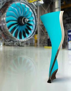 an airplane engine is seen in this artistic photo, with the turbine visible behind it