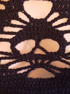 the crocheted material is black and white