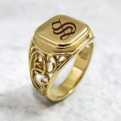 The initial signet ring is a classic piece of jewelry for both men and women. Bring a little bling with this unique square-shaped initial signet ring in 14k gold with your choice of initial letters made especially for you. The monogram seal ring is polished to a high finish and decorated with a delicate ornamental design that will certainly be noticed as a refreshing element in any day or night outfit. This monogram ring is a perfect gift for a birthday, anniversary, as bridesmaid's gift or for Gold Classic Signet Ring For Promise, Classic Gold Signet Ring For Promise, Classic Gold Rings With Monogram, Classic Engraved Initial Promise Ring, Classic Engraved Filigree Ring As Gift, Classic Engraved Filigree Ring Gift, Classic Polished Initial Ring For Promise, Classic 14k Stamped Signet Ring For Promise, Classic 14k Stamped Promise Signet Ring