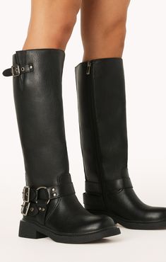 Take your style to new heights with this edgy take on a classic combat boot featuring statement buckle detailing. Tall Boots With Buckles, Biker Boots Outfit Winter, Bell Bottoms And Sweater, Fall And Winter Boots, Biker Boots Outfit, Motorcycle Boots Women, Groomsmen Accessories, Winter Boots Outfits, Black Moto Boots