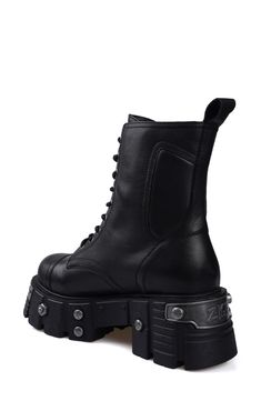 Bring bold biker edginess to your footwear collection with this heavy-duty combat boot set upon a lugged platform sole studded with rivet-style screws, bolts and a numbered plaque. 4" heel; 3 1/2" platform 6" shaft Lace-up style; side zip closure Water resistant Leather upper and lining/rubber sole Imported Platform Combat Boots, Womens Combat Boots, Combat Boot, Footwear Collection, Up Styles, Side Zip, Combat Boots, Rubber Sole, Leather Upper