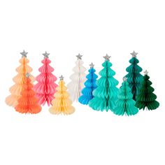 four different colored paper christmas trees with star decorations