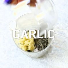 garlic and other ingredients in a blender with the word garlic overlaying it