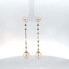 Introducing our Demure Chain Drop Pearl Earrings, a nod to the timeless beauty of pearls, reimagined for the modern woman. With their clean lines and elegant mirror chain drop, they’re the epitome of understated glamour. Each earring features 2 luminous pearls that delicately hang from a sleek 14K Gold mirror chain, creating a graceful drop that adds movement and flow to your look. With its sparkle and shine, it perfectly complements the soft glow of the pearls, creating a harmonious balance bet Drop Pearl Earrings, Elegant Mirror, Understated Glamour, Elegant Mirrors, Gold Mirror, Chain Earrings, Pearl Drop Earrings, Gold Pearl, Pearl Drop