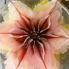 a flower that is inside of a glass bowl