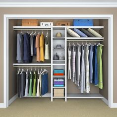 an open closet with clothes hanging on shelves