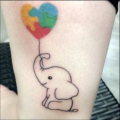 an elephant with a heart shaped balloon tattoo on its leg is shown in black ink