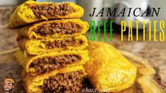 jamaican beef patties stacked on top of each other