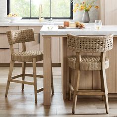 two wicker bar stools in a kitchen