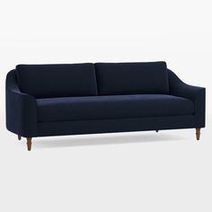 a dark blue couch with wooden legs