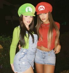 two young women dressed in mario and luigi hats