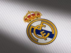 the real madrid crest is shown in gold and blue